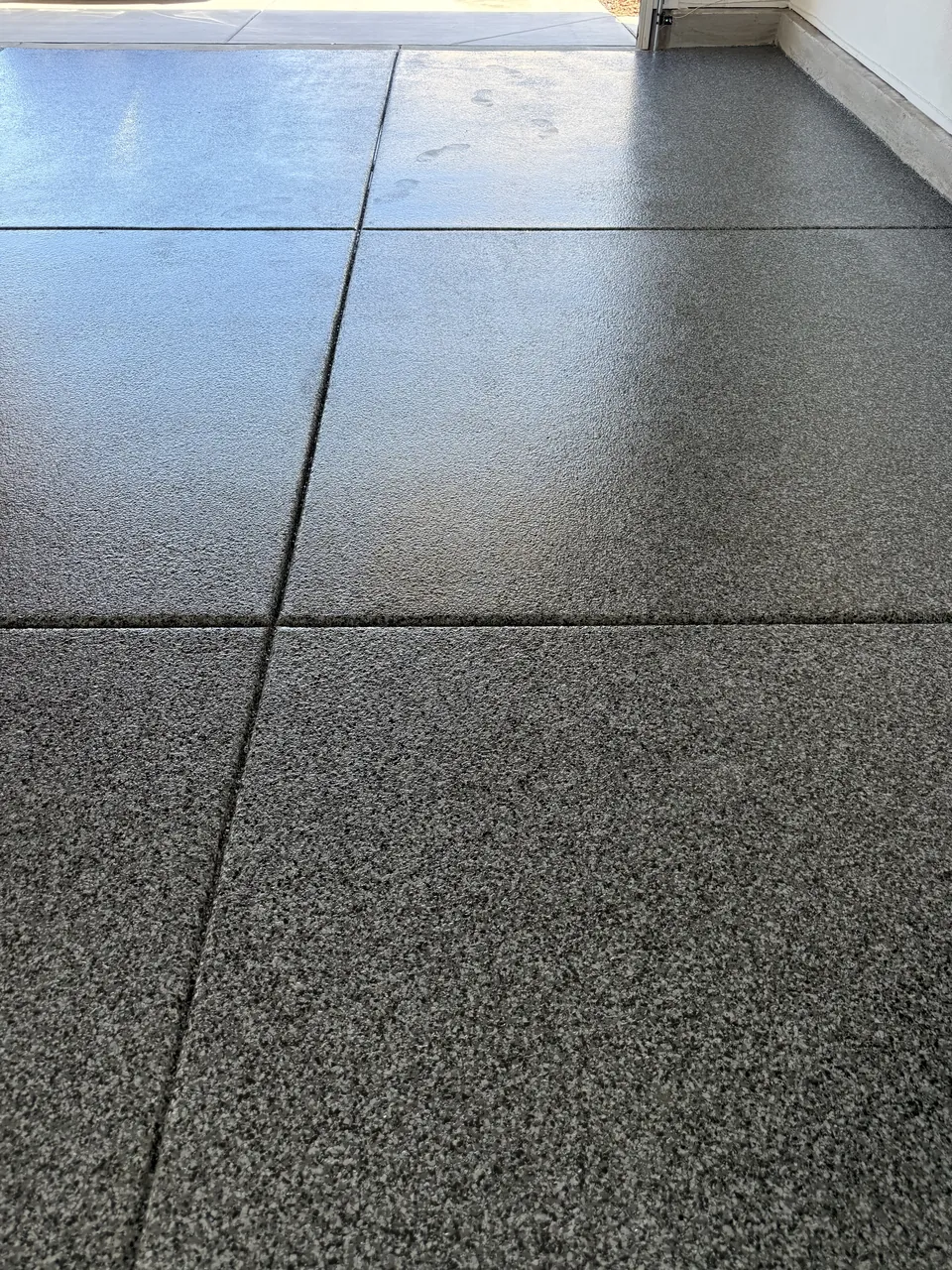 After: gray full-broadcast flake floor in the same Natomas garage