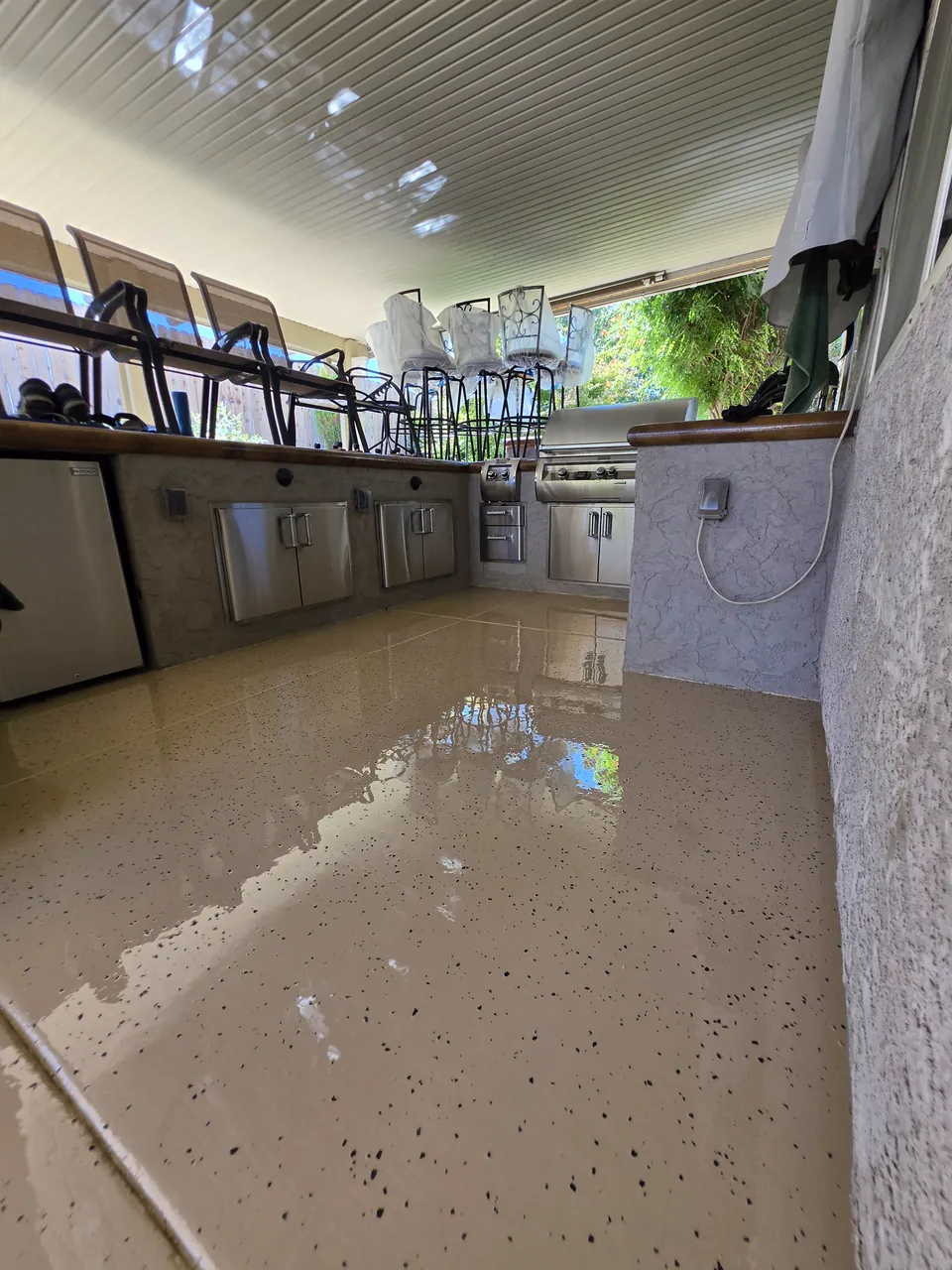 Covered patio flake floor looking out to the yard