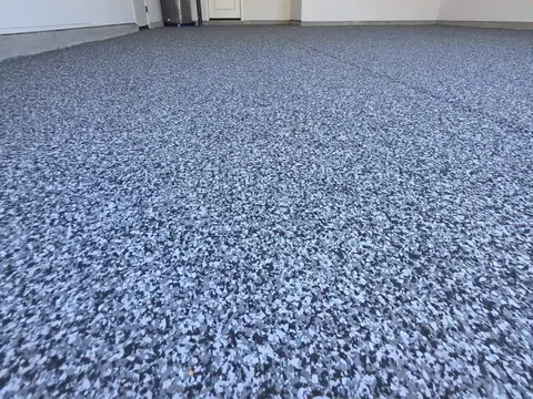 White, gray and black flake epoxy floor in a new-build Sacramento garage